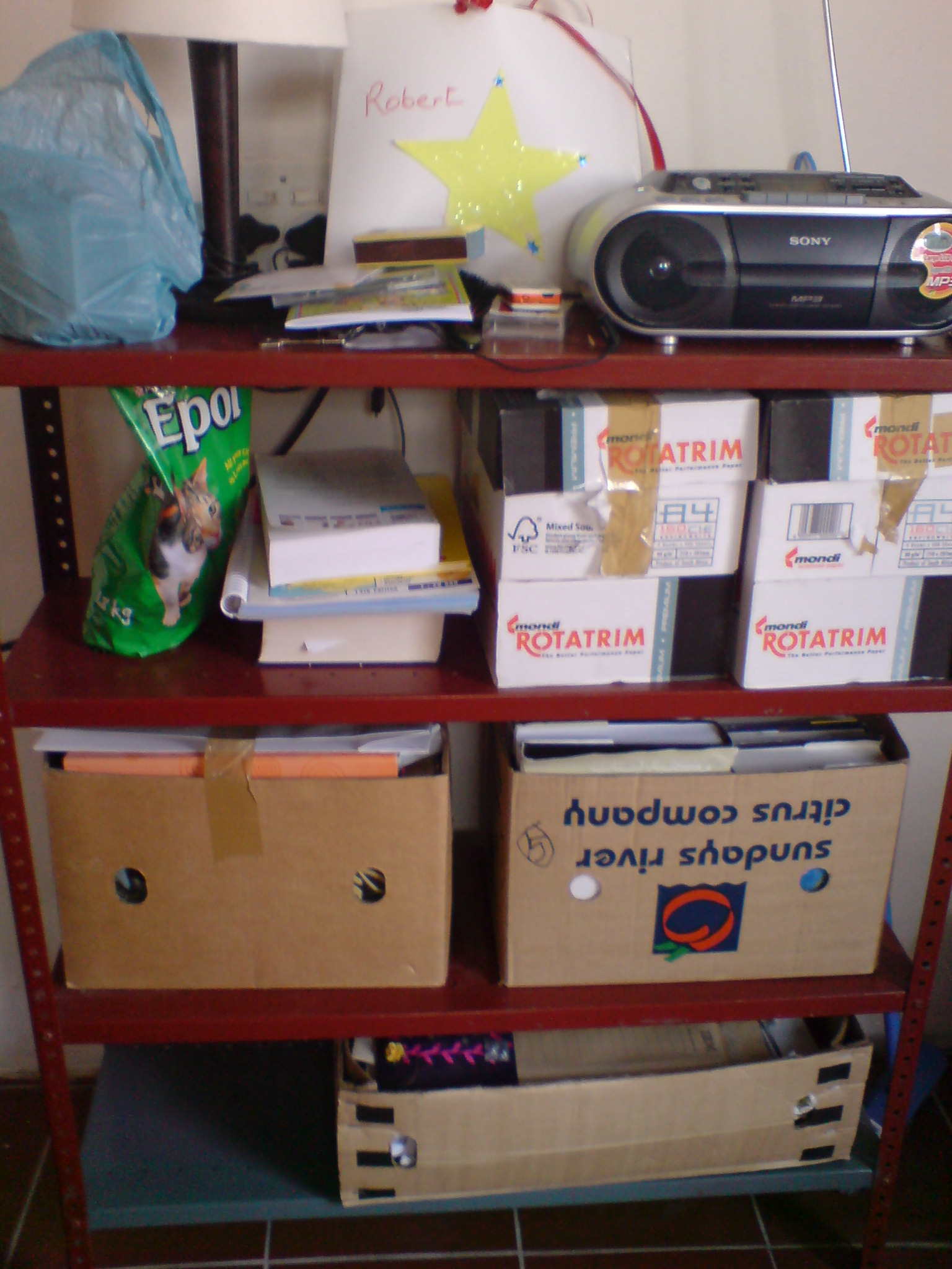 Books, Catfood, Reading lamp and Radio, Conveniently on One Shelf Books, Catfood, Reading lamp and Radio, Conveniently on One Shelf